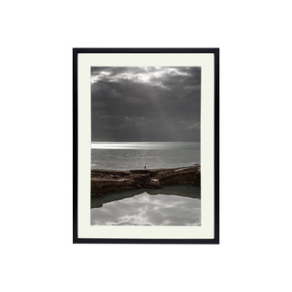 P-10-101-117-107-0032-1.jpg;ocean, tide, clouds, figure, person, rocks, stone, nature, sunbeam, cool tones, gray, brown, white