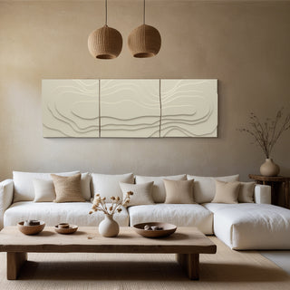 Modern living room with a white sofa, wooden coffee table, and abstract wall art.