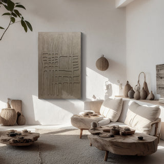 Modern living room with neutral tones, textured wall art, and decorative items.